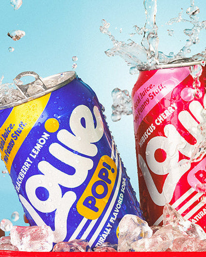 Four colorful Louie Pop! soda cans emerging from ice in a red cooler against a bright blue background, with water splashing above each can.